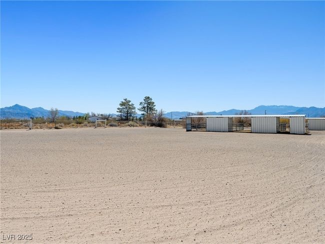View of yard featuring an outdoor structure and a mountain view | Image 62