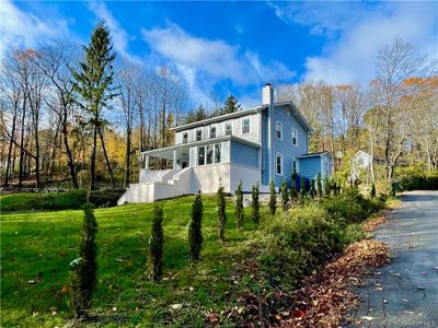 View of property exterior featuring a yard | Image 1