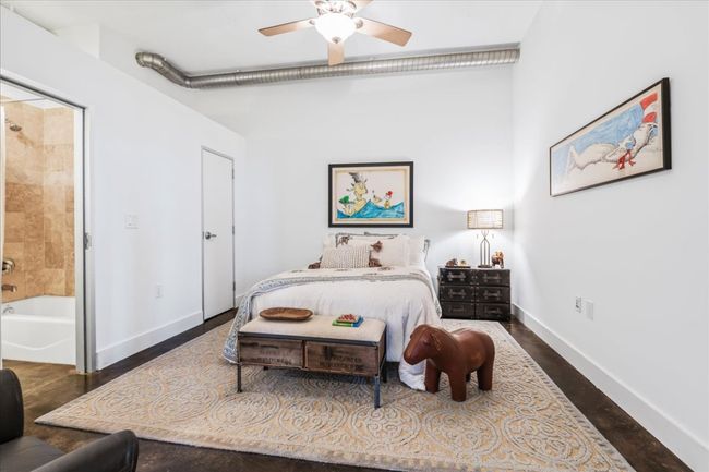2nd Bedroom with ensuite bath, a ceiling fan, and stained concrete floors | Image 18