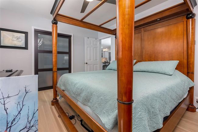 Bedroom with ceiling fan and light hardwood / wood-style floors | Image 22