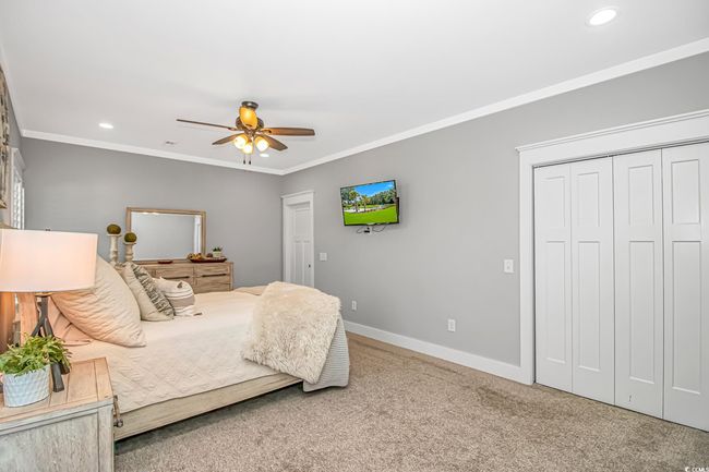 Bedroom featuring carpet, recessed lighting, ornamental molding, a closet, and ceiling fan | Image 14