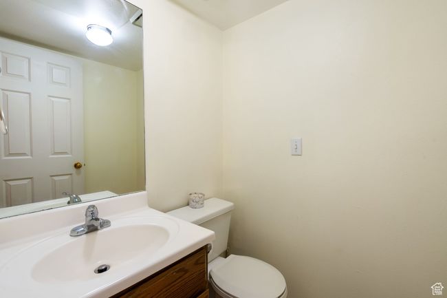 Half bathroom with toilet and vanity | Image 11