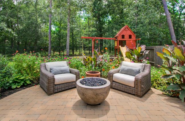 Fire pit is fed by concealed propane tank | Image 34