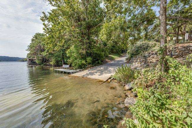 Water view with a dock | Image 36