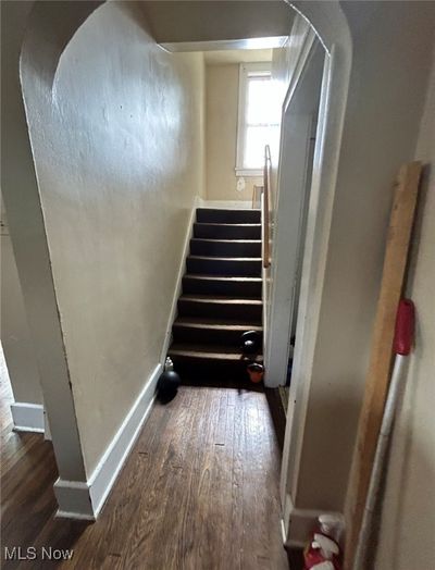 Staircase with hardwood / wood-style floors | Image 3