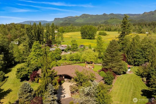 Outbuildings, barn, and greenhouse add space for animals, gardening, equestrian pursuits, or business ideas—imagine a wellness retreat, Airbnb, or wedding venue. | Image 6