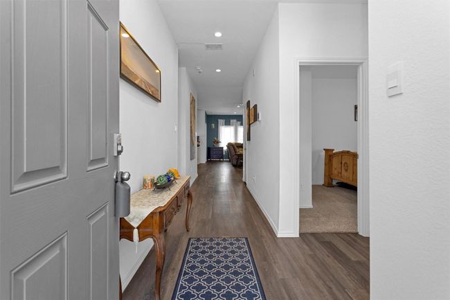 Step inside to vinyl plank flooring. | Image 5