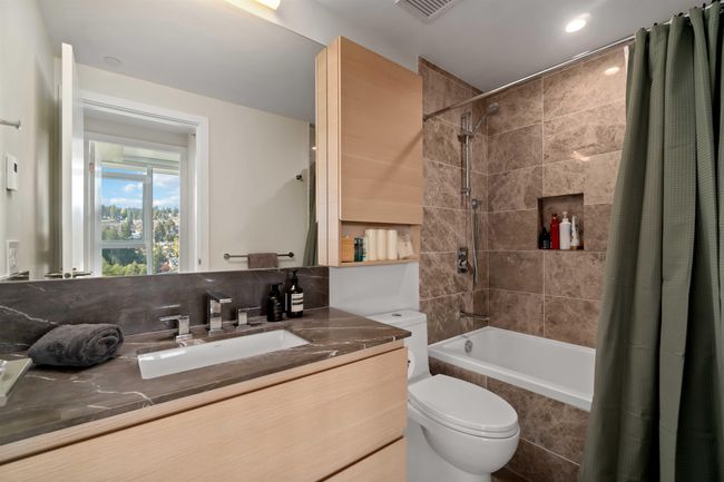 Full bath with vanity, visible vents, toilet, and tiled shower / bath combo | Image 19