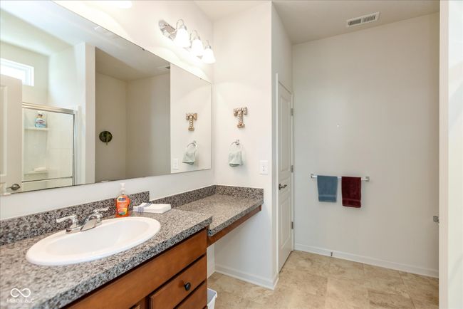 bathroom featuring vanity and a shower stall | Image 17