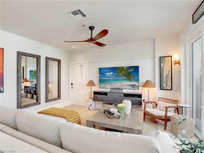 Living room featuring a ceiling fan and baseboards | Image 19