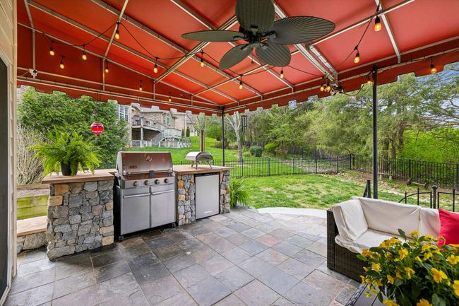 Everyone wants a little outdoor kitchen to do their grilling! Don't miss the undercounter refrigerator too! Wow! | Image 48
