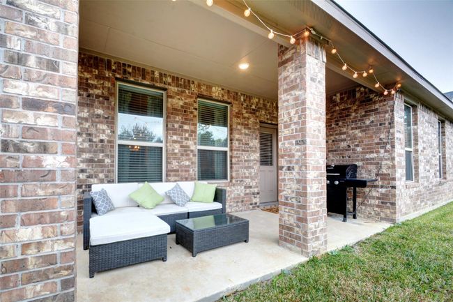 The covered patio is wonderful for grilling or just relaxing. | Image 25