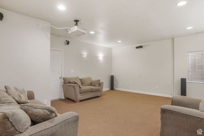 Living room featuring recessed lighting, visible vents, light carpet, and baseboards | Image 24