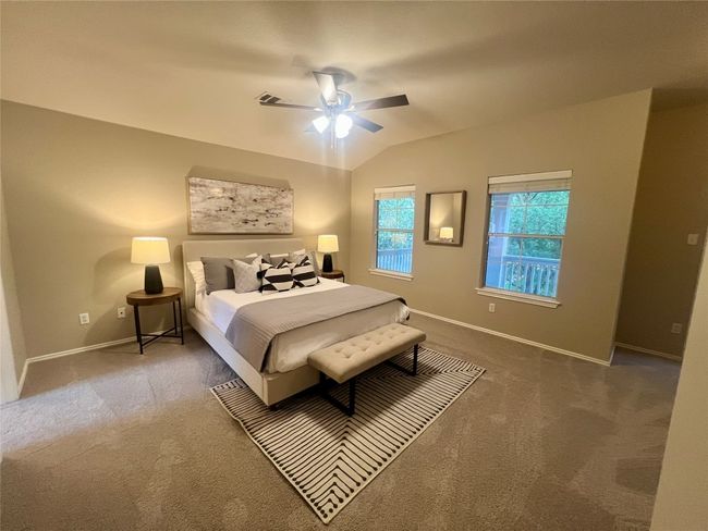 Carpeted bedroom featuring vaulted ceiling and a ceiling fan | Image 22