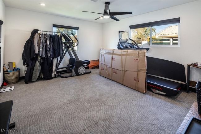 Workout room featuring recessed lighting, light colored carpet, and a ceiling fan | Image 24
