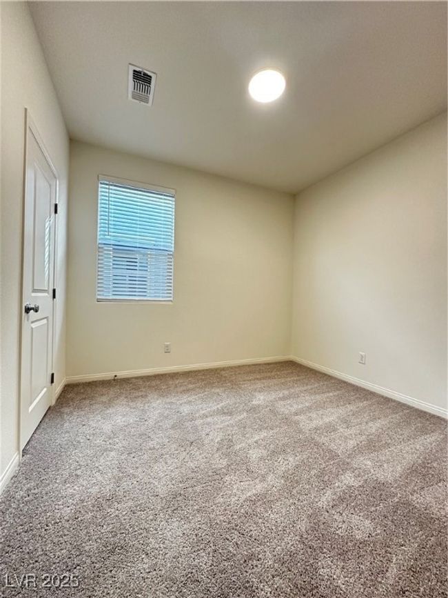 Unfurnished room with carpet floors, baseboards, and visible vents | Image 8