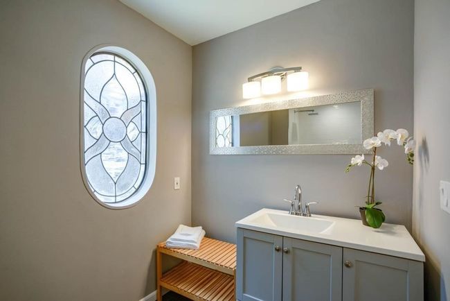 Bathroom featuring vanity and baseboards | Image 15