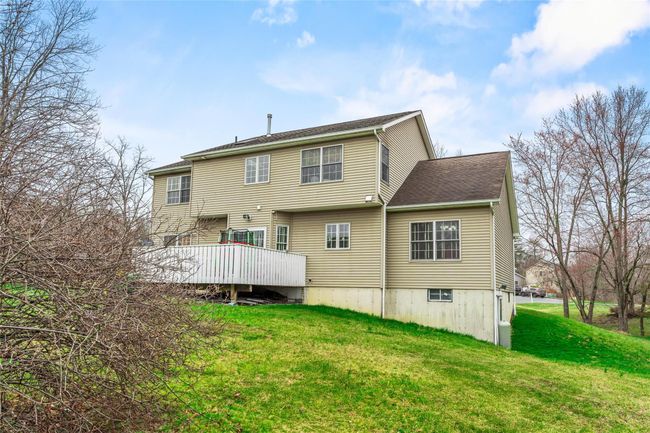 Back of property featuring a lawn and a deck | Image 45
