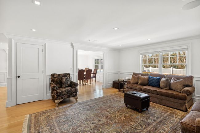 Living room featuring wood-type flooring and ornamental molding | Image 14