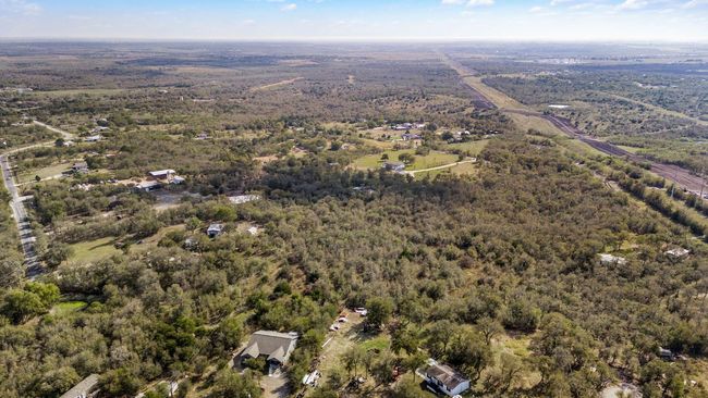 Aerial view of property and surrounding area featuring a forest | Image 10