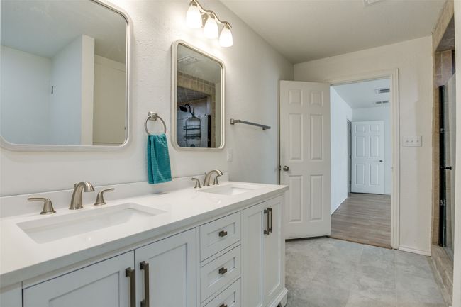 Full bathroom featuring double vanity | Image 21