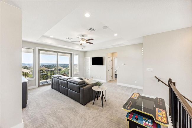 The spacious game room also features three separate storage closets—perfect for AV equipment, games, toys, or anything else you want to keep out of sight. | Image 26