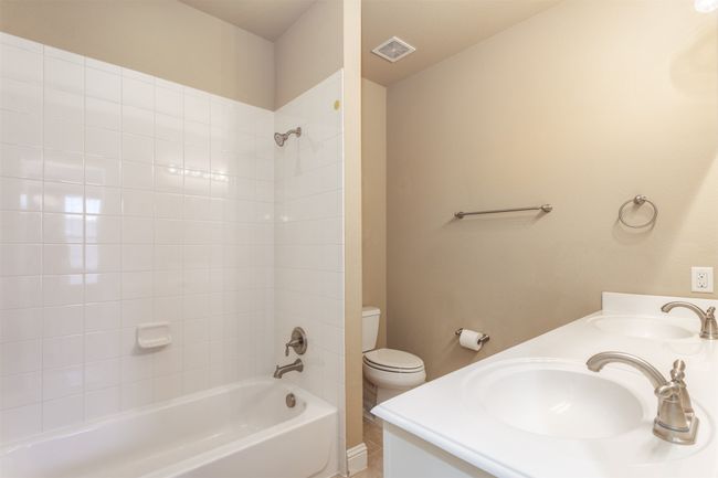 Full bathroom with visible vents, toilet, shower / bathtub combination, and a sink | Image 29