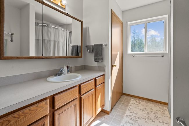 Bathroom featuring vanity, baseboards, and a shower with shower curtain | Image 20
