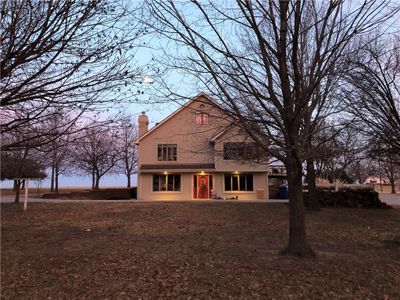 View of back house at dusk | Image 1