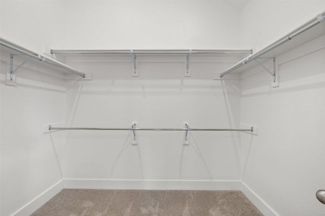 Spacious closet with carpet flooring | Image 19