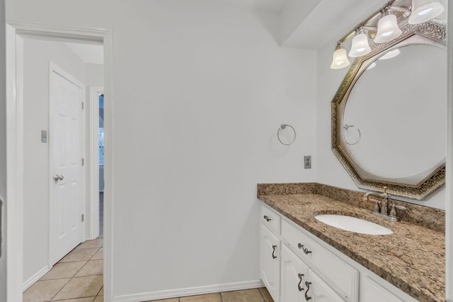 Bathroom with vanity and tile patterned floors | Image 26