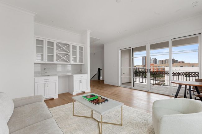 The built in concession center features drawers and cabinets, bottle storage, glass-front display, and an optional upgrade to include a beverage refrigerator. | Image 33