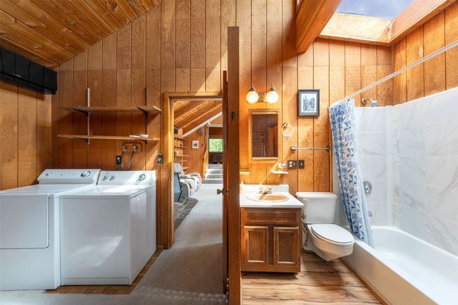 Main level bedroom with laundry and full bathroom | Image 35