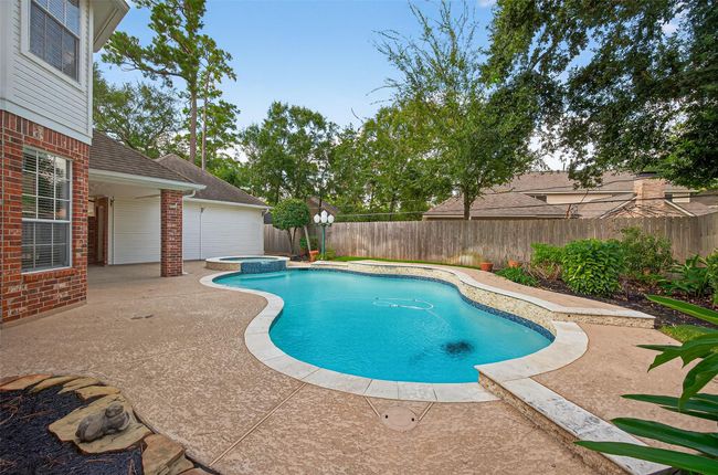 Pool and Spa with recent aesthetic upgrades including tile, coping and water features. | Image 44