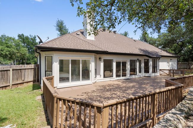 Back of house with a shingled roof and a chimney | Image 32