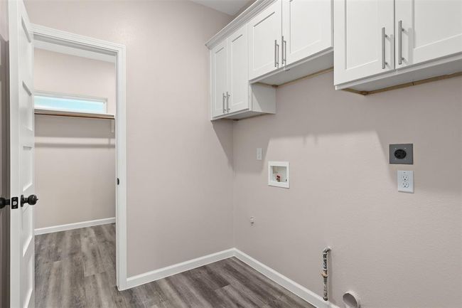 Laundry room with access from the hallway and the primary suite | Image 22