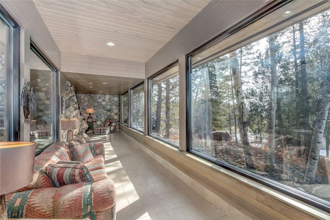 Sunroom / solarium featuring wood ceiling | Image 4