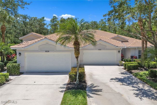 Single story home with concrete driveway, a tiled roof, stucco siding, and an attached garage | Image 29