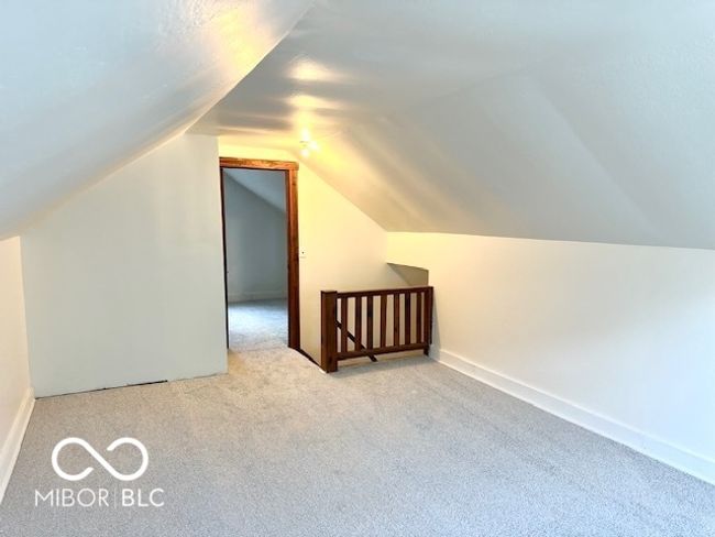 additional living space featuring carpet flooring and lofted ceiling | Image 10