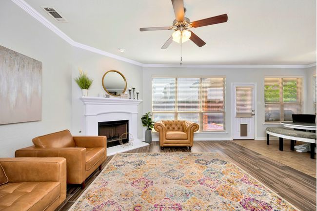 Fireplace centers this inviting Living Room | Image 11