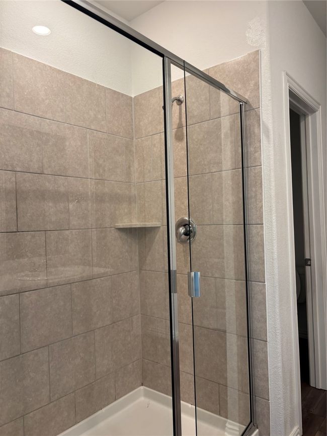 Bathroom with a stall shower | Image 12
