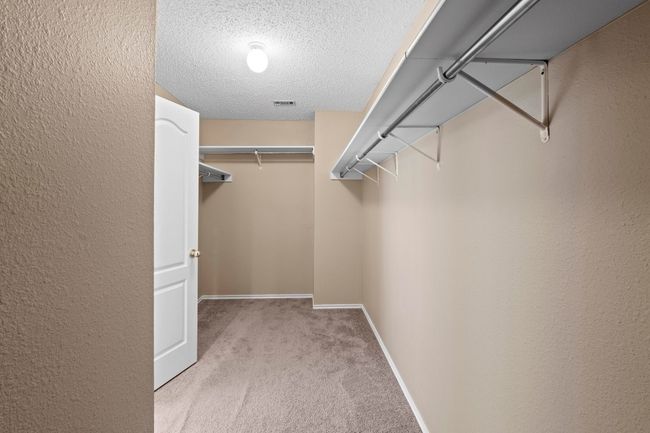 Spacious closet with carpet | Image 24