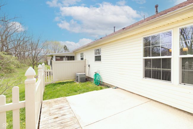 rear view of property with a patio area and fence | Image 30