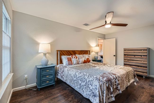 Bedroom featuring dark wood-type flooring and ceiling fan | Image 16