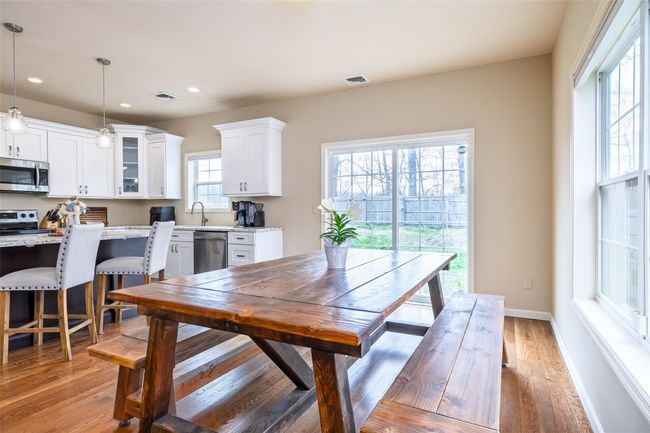 Dining area with baseboards, light wood-style flooring, visible vents, and recessed lighting | Image 8