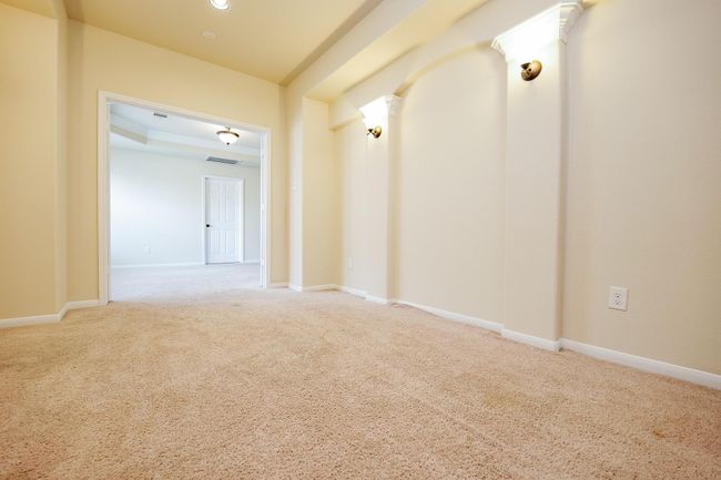 Gorgeous, art-deco-like column detail enhances your rich cinema room, which opens onto common 'game room' space on the 2nd level. | Image 18
