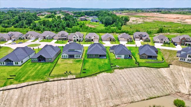 Enjoy expansive backyard views with no rear neighbors. These homes back to a greenbelt and open drainage easement, offering a peaceful setting with extra privacy and space to unwind. | Image 47