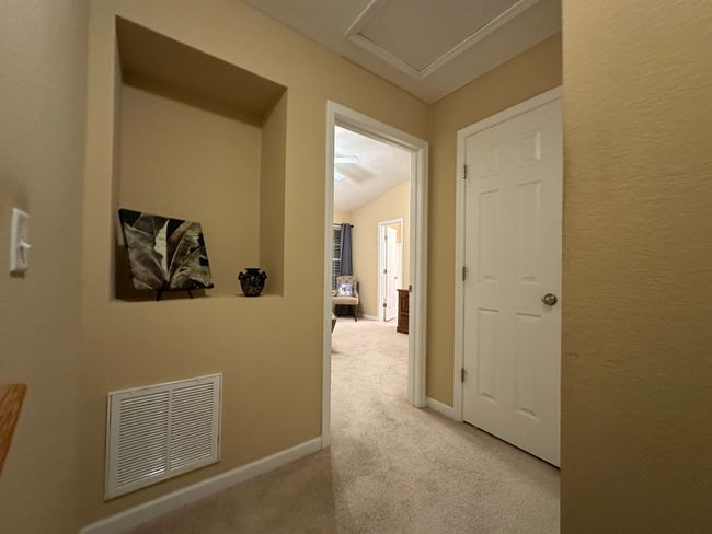 In this photo you see the storage closet across from the alcove also separating the bedrooms | Image 29