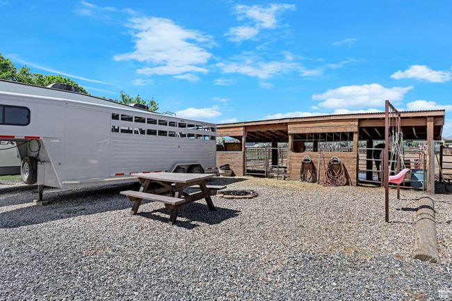 View of community with an exterior structure and an outbuilding | Image 36