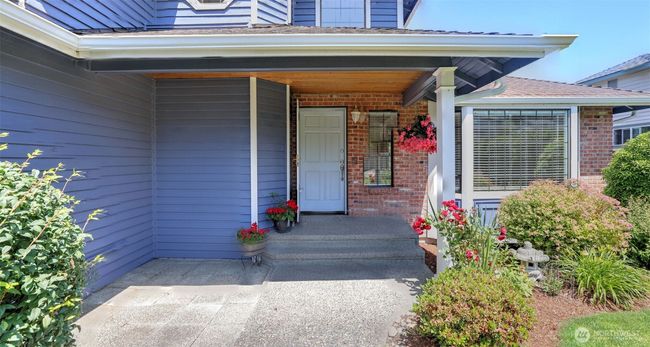 Covered Front Entry with extra patio out front! | Image 4